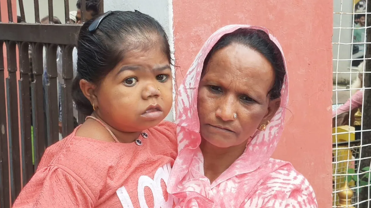 holding daughter in arms